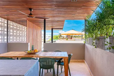 a dining room with a wooden table and chairs at Casa Emilia - Luxury Villa in the Historic Center in Cartagena de Indias