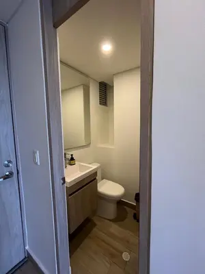 a bathroom with a white toilet and a sink at Apartamento en Cielo Mar Cartagena in Cartagena de Indias