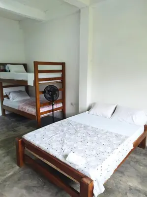 a bedroom with two beds in a room at Mi refugio in Moñitos