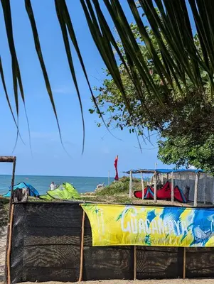 a playground on the beach with the ocean in the background at Guacamaya Kite Lodges in Salina de Rey