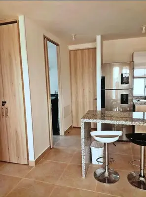 a kitchen with a counter and a island in a room at Capriella,Cartagena in Cartagena de Indias