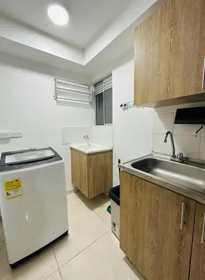 a small kitchen with a sink and a sink at cool and quiet apartment in front of the urban forest in Barranquilla