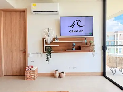 a living room with a tv on the wall at Magnificent Apartment - Beach - Jacuzzis! in Cartagena de Indias