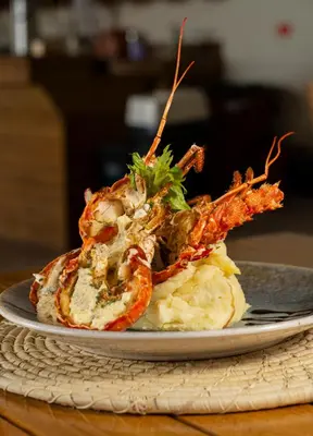 a plate of food with a crab on top at Casa Barú in Baru
