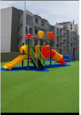 a playground with a slide in a park at Comfortable and nice apartment in Barranquilla