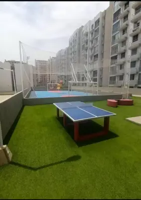a ping pong table on the roof of a building at Comfortable and nice apartment in Barranquilla