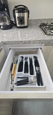 a drawer in a kitchen with utensils in it at Modern apt in Cartagena with pool and beach access in Cartagena de Indias