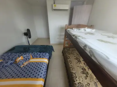 a bedroom with two twin beds and a phone at Romero Cartagena in Cartagena de Indias