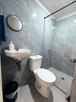 a bathroom with a toilet and a sink at Maru apartamentos #5 in Cartagena de Indias
