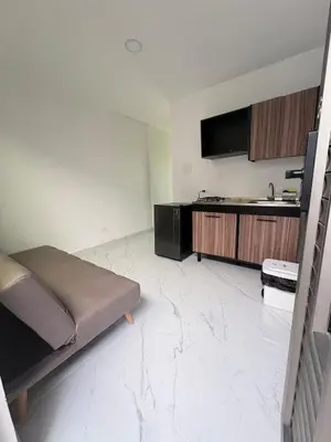 a living room with a couch and a kitchen at Maru apartamentos #6 in Cartagena de Indias