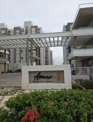 a sign in front of a large building at Exclusivo apartamento en ciudad Mallorquin in Barranquilla