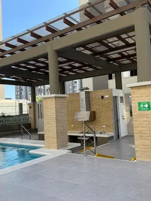 a pergola over a swimming pool in a building at Exclusivo apartamento en ciudad Mallorquin in Barranquilla