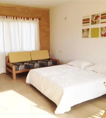 a bedroom with two beds and a window at Apartamentos frente al Mary Tolu - Coveñas in San Silvestre