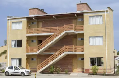 a building with a staircase on the side of it at Apartamentos frente al Mary Tolu - Coveñas in San Silvestre