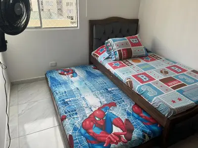 a bedroom with a bed with a spiderman quilt at Alameda del rio Turpial in Barranquilla