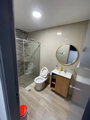 a bathroom with a toilet and a sink and a mirror at Apartamento en el Norte a 5 Minutos de Buenavista in Barranquilla