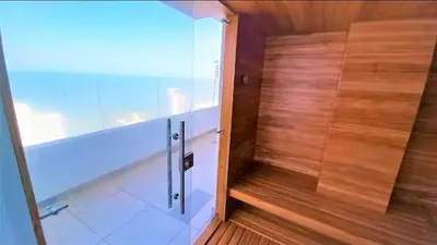a bathroom with a shower with a wooden wall at Incredible apartment in Cartagena a few meters from the Sea in Cartagena de Indias