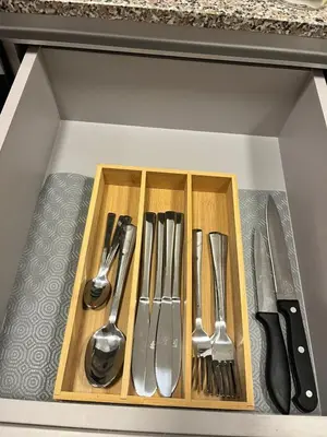 a drawer filled with knives and forks and spoons at Loft cerca a la playa en Santa Marta Wi-Fi- Santa Marina in Santa Marta