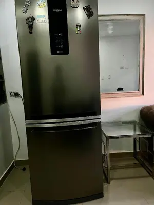 a refrigerator with magnets on it in a kitchen at Apartamento DUPLEX para Grupos 9 pax in Cartagena de Indias