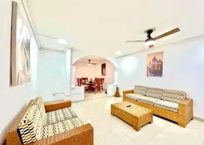 a living room with two couches and a table at Apartamento en Cartagena Manga 3 Habitaciones - Bahia in Cartagena de Indias