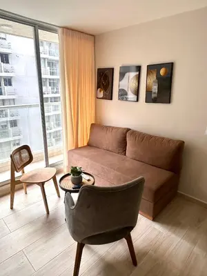 a living room with a couch and a table at Apto de lujo en Barranquilla in Barranquilla