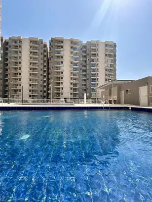 a large swimming pool in front of tall buildings at Apto de lujo en Barranquilla in Barranquilla
