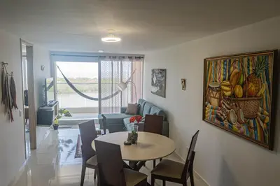 a living room with a table and a couch at Ocean View Apartment - Soho Playa Mendoza in Tubará