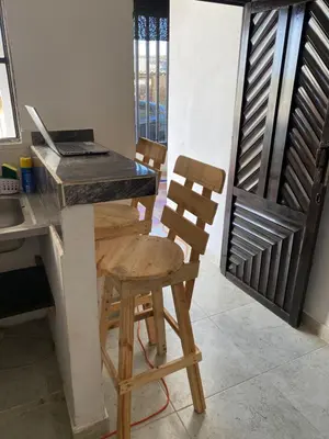 a kitchen with a table and two chairs and a desk at Casa Lagomar in Pradomar