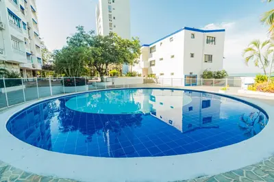 a swimming pool in the middle of a building at Paraíso By Elemnt Rentals in Santa Marta