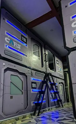 a room with a train with blue lights on it at Hotel Capsula CAPS Cartagena in Cartagena de Indias
