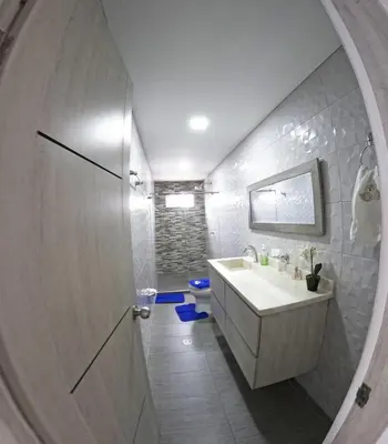 a bathroom with a sink and a mirror at Viewpoint apartment near the Historic Center in Cartagena de Indias