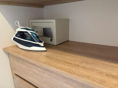 a helmet is sitting on a counter next to a microwave at Apt 2 rooms with private beach and ideal pool in Cartagena de Indias