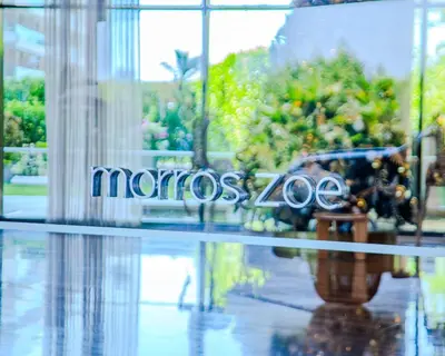 a reflection of a sign in the window of a store at Apt 2 rooms with private beach and ideal pool in Cartagena de Indias