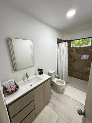 a bathroom with a white sink and a toilet at Casa2 Duplex AC WiFi Piscina Acceso al mar in San Bernardo del Viento