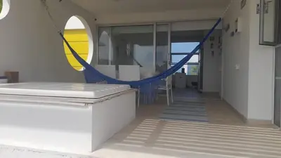a hallway with a blue rope in a building at Marina Puerto Velero Cabaña in Tubará
