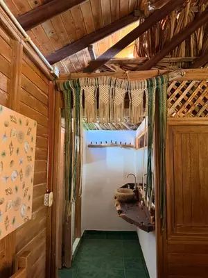 an inside view of a room in a wooden house at Cabaña 8 personas frente al mar con deck privado in Moñitos