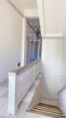 a staircase in a building with a gate on it at Experience the magic of the Calle de las Damas historic center in Cartagena de Indias