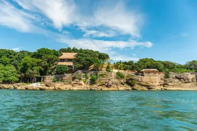 a resort on a rocky island in the water at Paradise Private Kaimari Ocean Villa in Cartagena de Indias