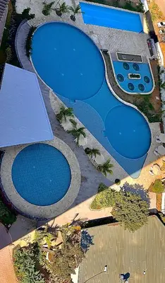 an overhead view of two swimming pools at Aqua Marine Suite - Santa Marina Condo in Santa Marta