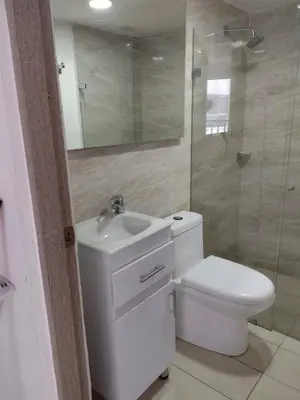 a bathroom with a toilet and a sink and a shower at Beatifull apartment near Hilton hotel in Cartagena de Indias