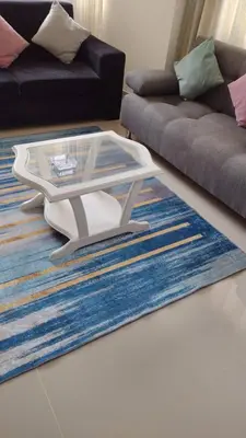 a living room with a coffee table on a rug at Beatifull apartment near Hilton hotel in Cartagena de Indias