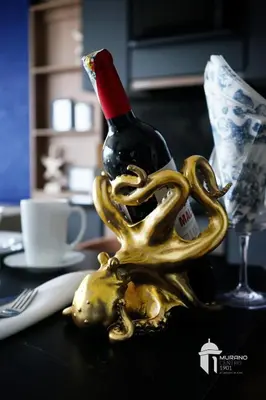 a bottle of wine sitting on a table with a skull at NEW Apartment, best rooftop pool view, Cartagena - Visitors NOT ALLOWED in Cartagena de Indias