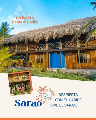 a house with a thatched roof at Sarao Mar in Moñitos