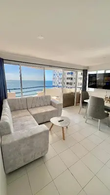 a living room with a couch and a table at Apartamento Marina del Rey 1101 in Cartagena de Indias