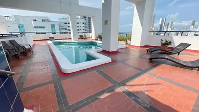 a patio with a swimming pool on top of a building at Apartamento Marina del Rey 1101 in Cartagena de Indias