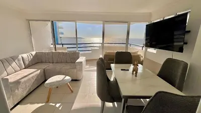 a living room with a couch and a table at Apartamento Marina del Rey 1101 in Cartagena de Indias