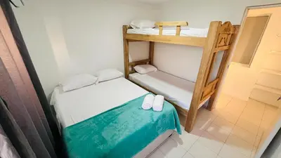 a small room with two bunk beds and a ladder at Apartamento Marina del Rey 1101 in Cartagena de Indias