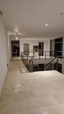 an empty room with a staircase in a house at Apto puerto velero in Barranquilla