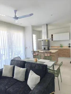a living room with a couch and a table at Apto 411 puerto velero in Tubará