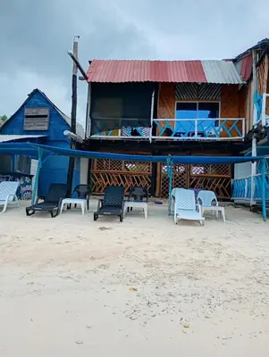 a group of chairs sitting in front of a building at Paraíso de corales in Playa Blanca